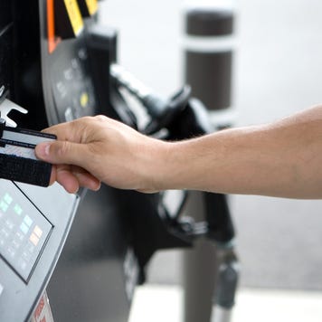 Person at gas pump